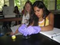 PAN students prepare a radioactive source for use in the lab.